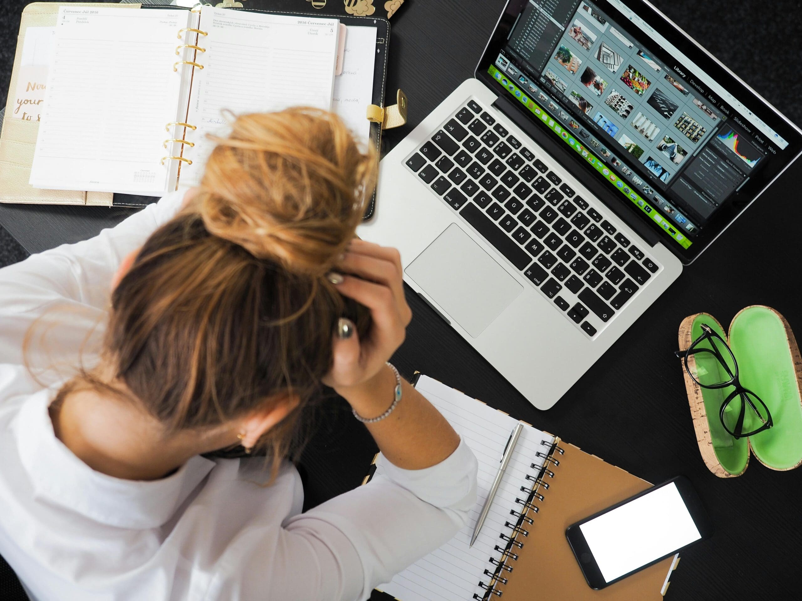Career coach analyzing job descriptions on a laptop during a midlife career transition.